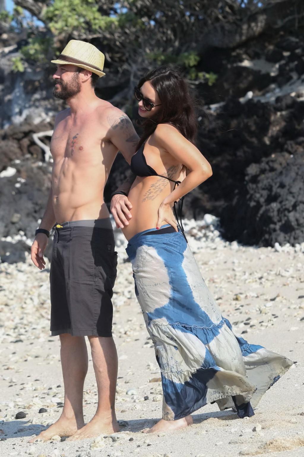 16P Megan Fox showing her boobs and big belly in black bikini
