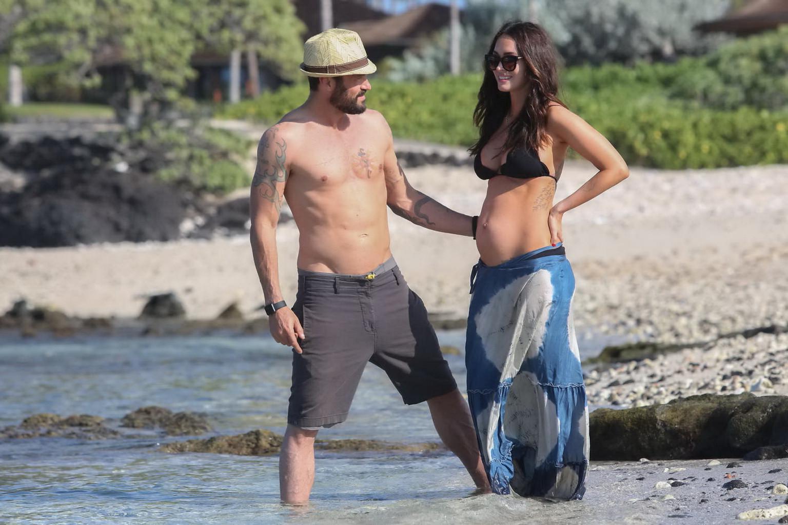 16P Megan Fox showing her boobs and big belly in black bikini