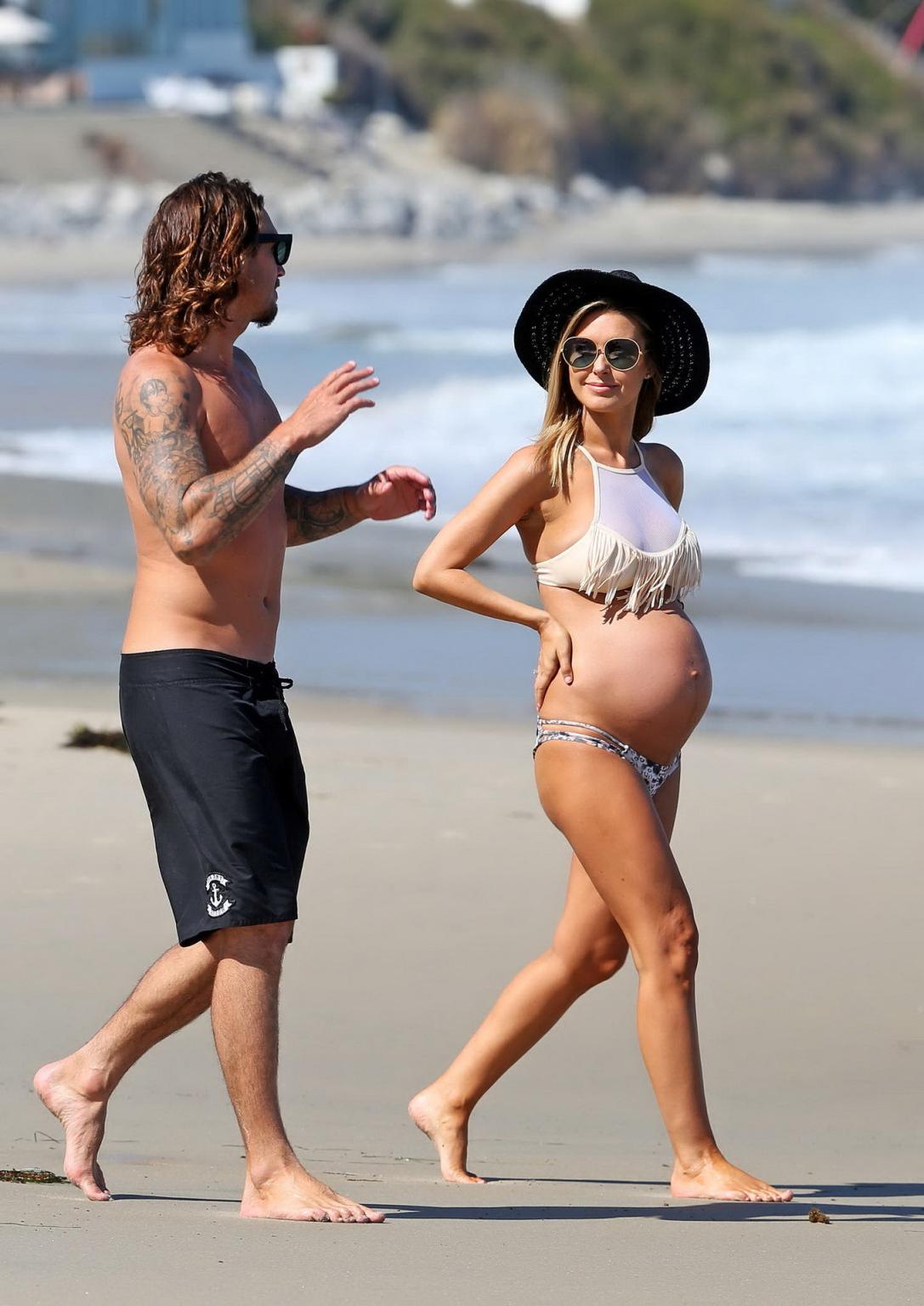 16P Audrina Patridge showing huge belly and boobs in a bikini