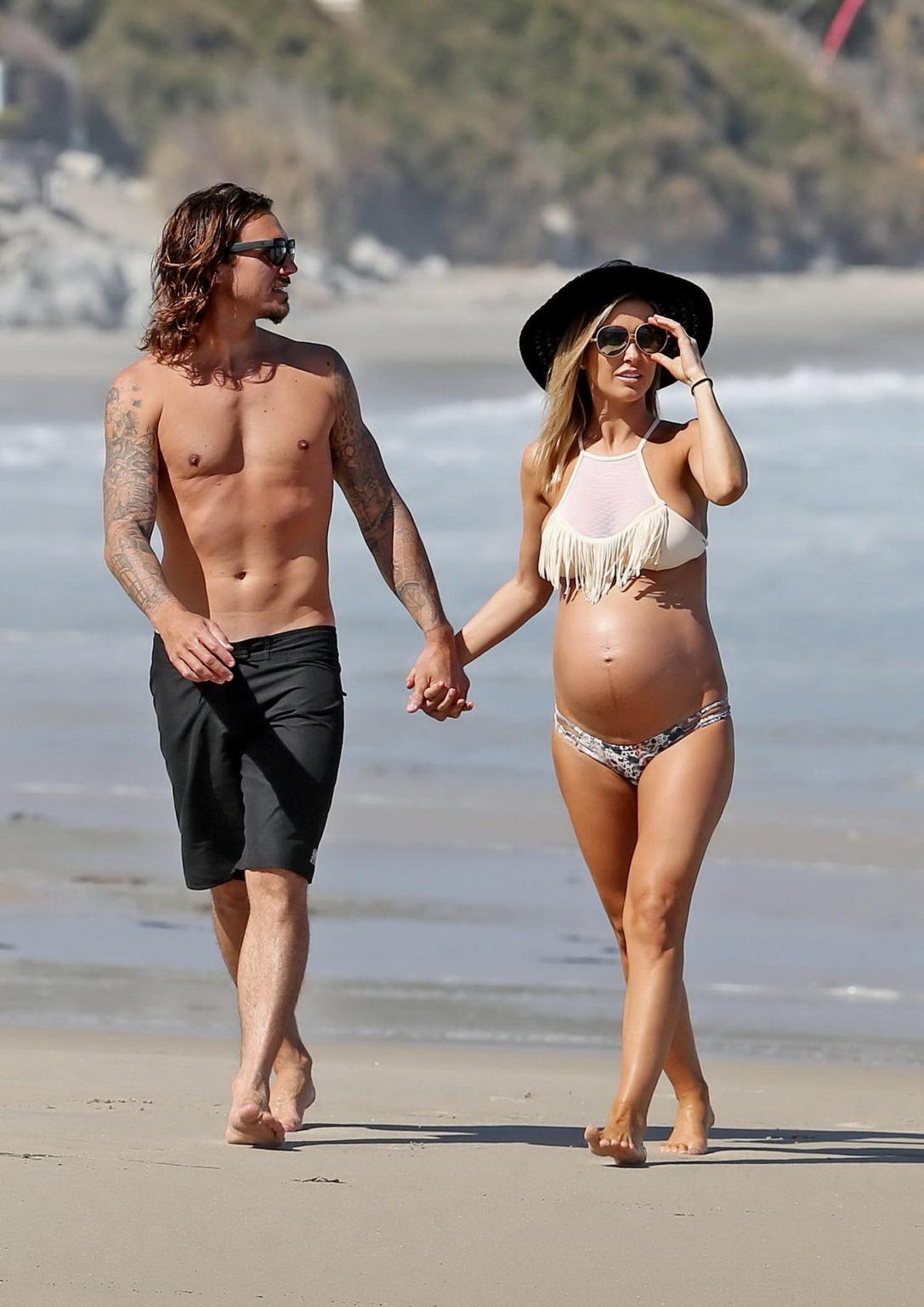 16P Audrina Patridge showing huge belly and boobs in a bikini