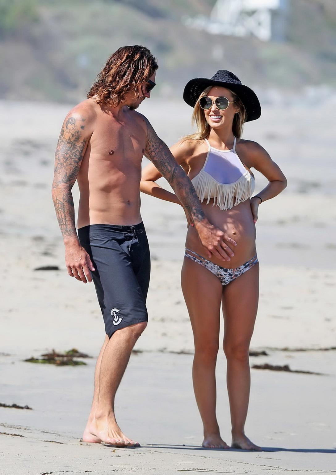 16P Audrina Patridge showing huge belly and boobs in a bikini