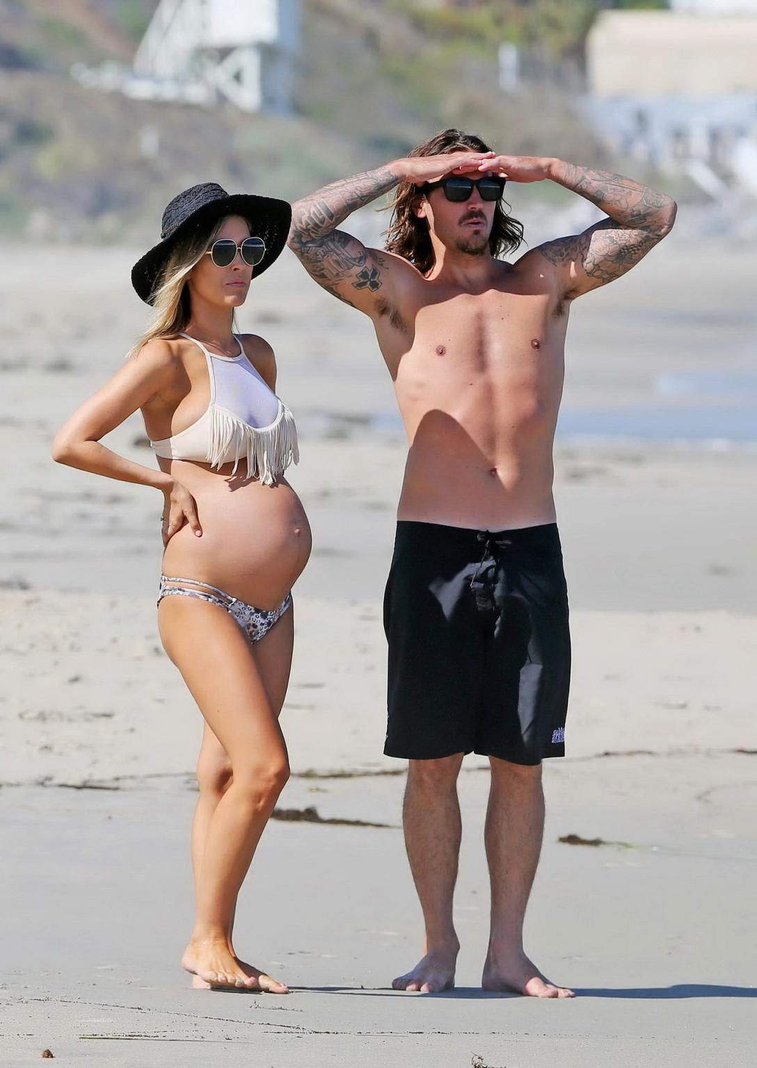 16P Audrina Patridge showing huge belly and boobs in a bikini