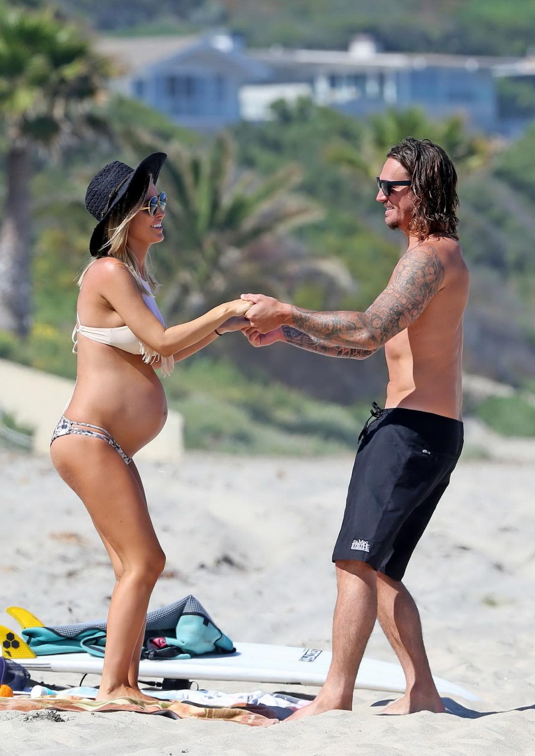 16P Audrina Patridge showing huge belly and boobs in a bikini