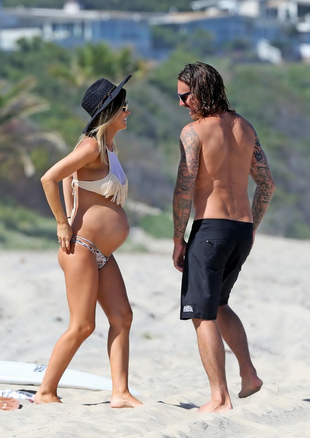 16P Audrina Patridge showing huge belly and boobs in a bikini