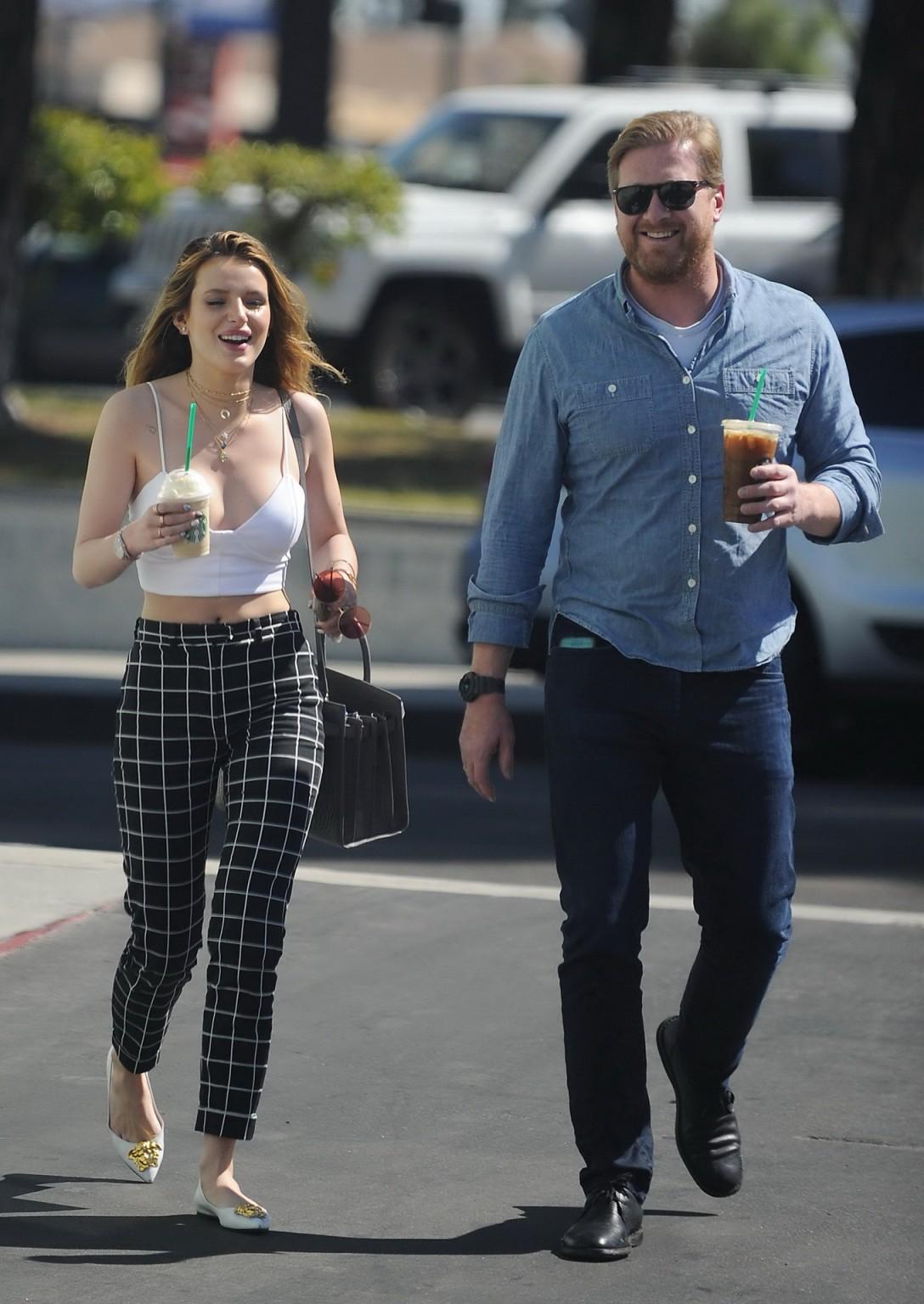 16P Bella Thorne busty in tiny white belly top sucking a coffee