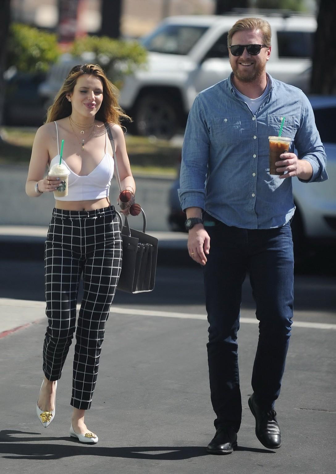 16P Bella Thorne busty in tiny white belly top sucking a coffee