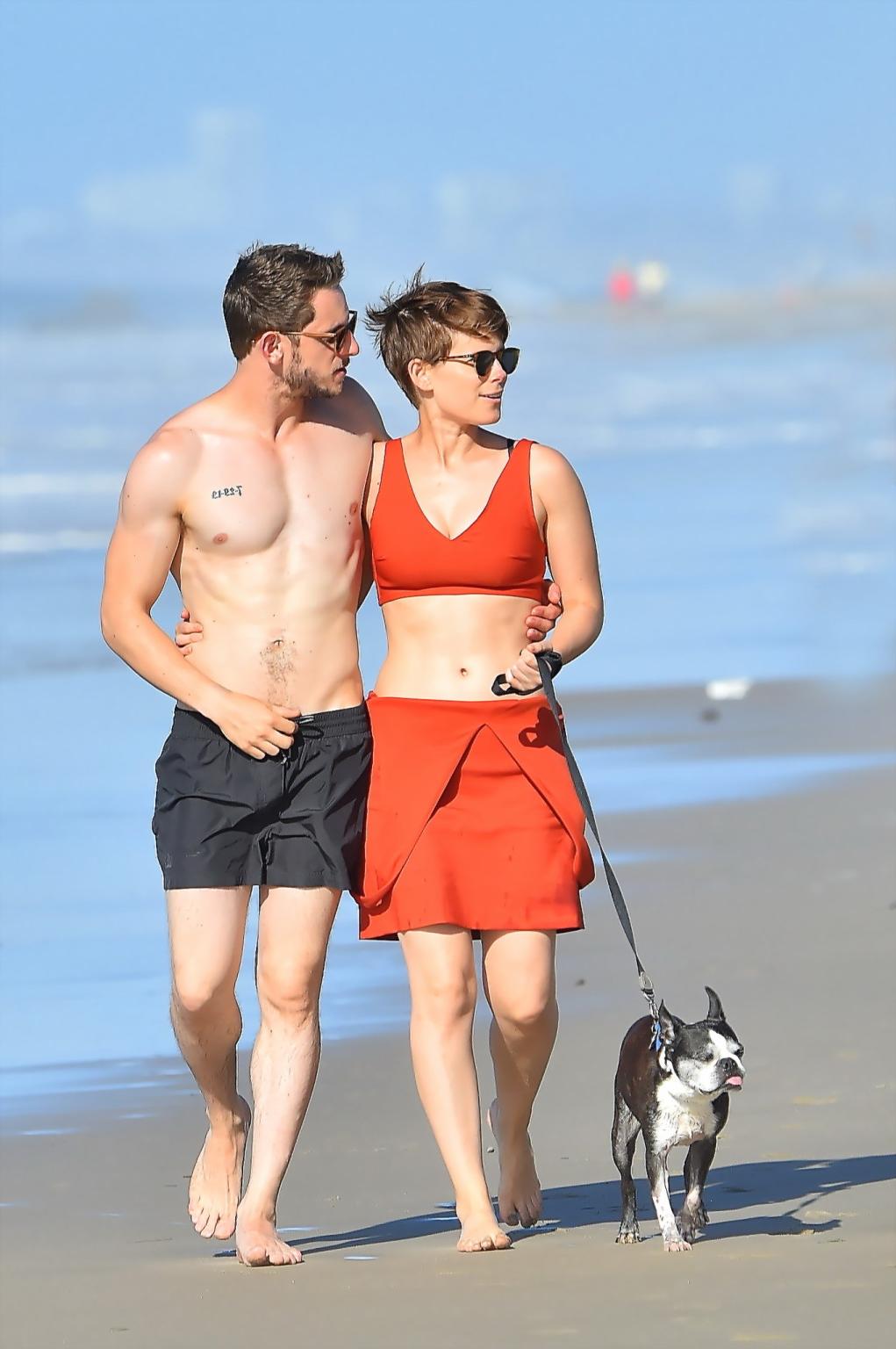 16P Kate Mara busty in belly top and mini skirt at the beach