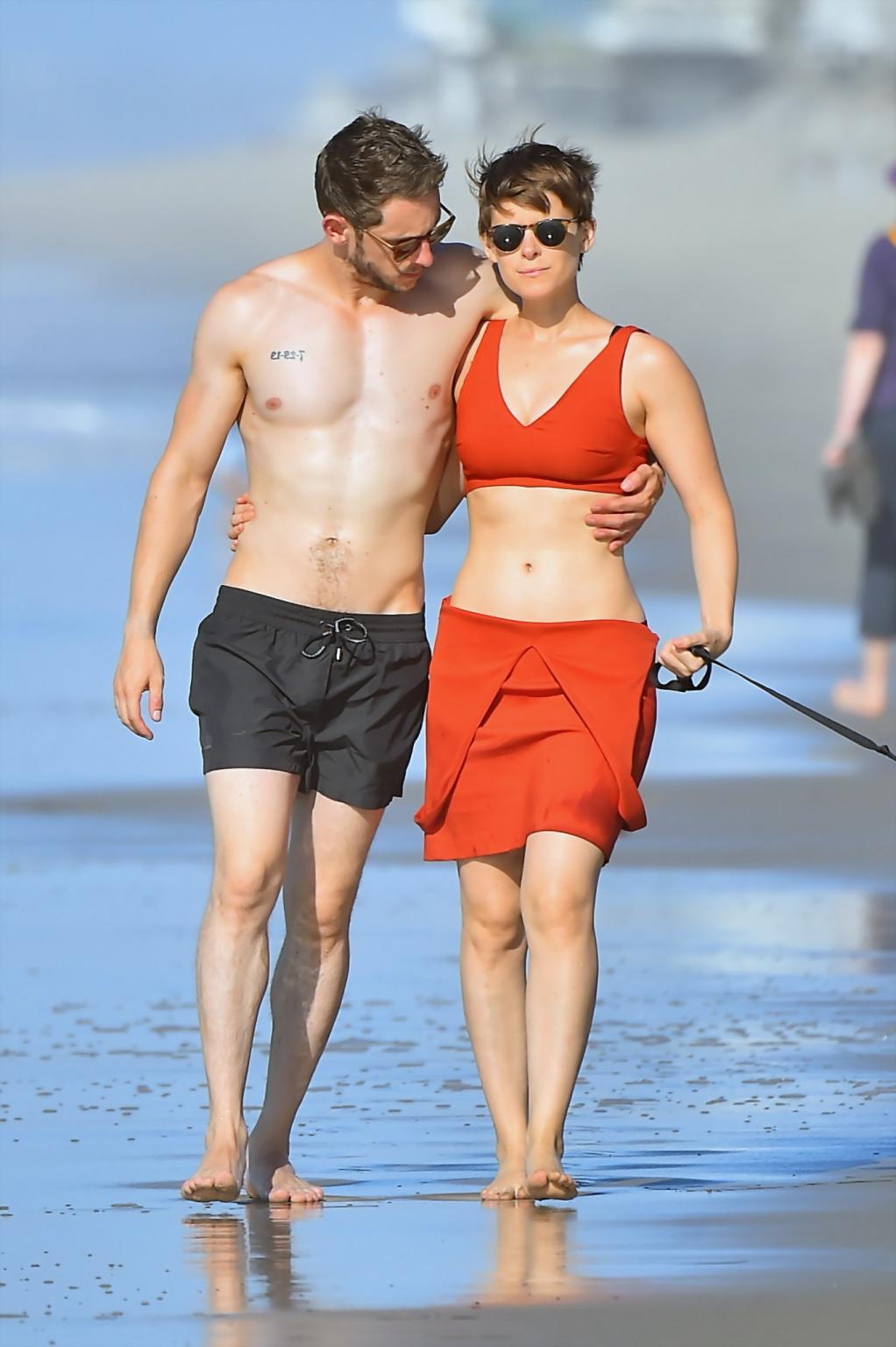 16P Kate Mara busty in belly top and mini skirt at the beach
