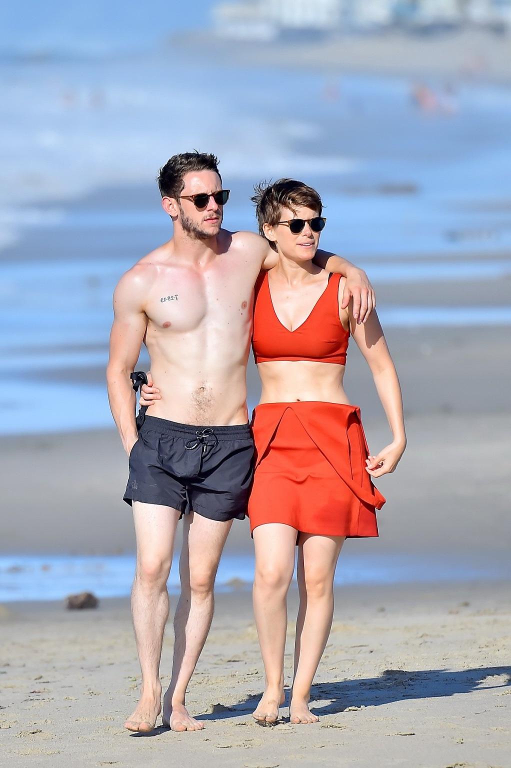 16P Kate Mara busty in belly top and mini skirt at the beach