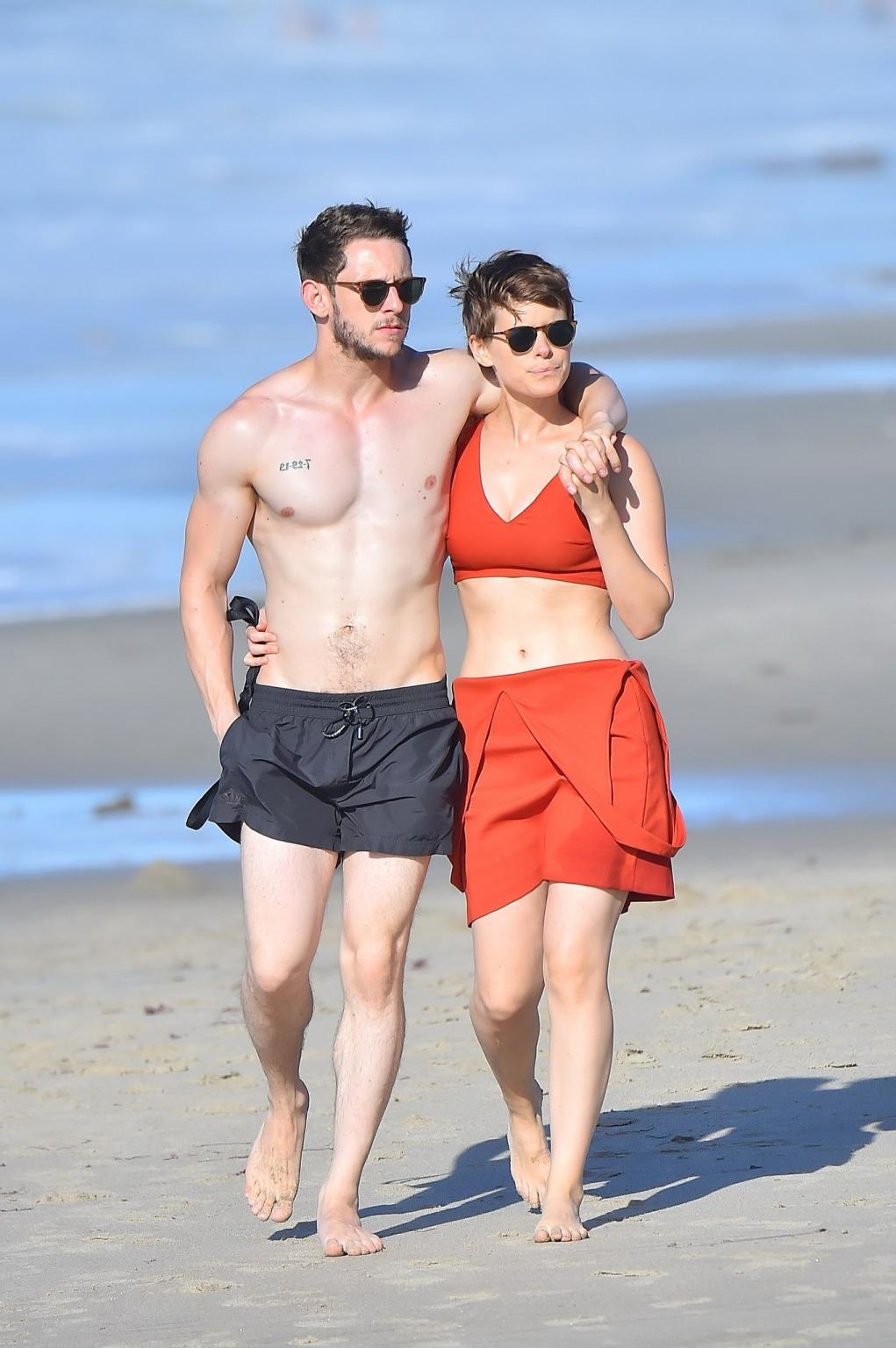 16P Kate Mara busty in belly top and mini skirt at the beach