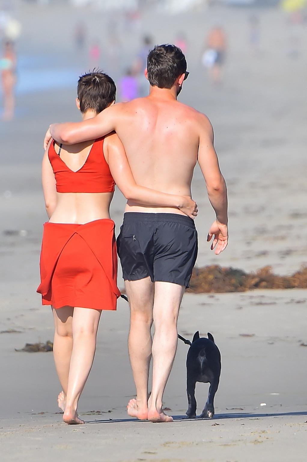 16P Kate Mara busty in belly top and mini skirt at the beach