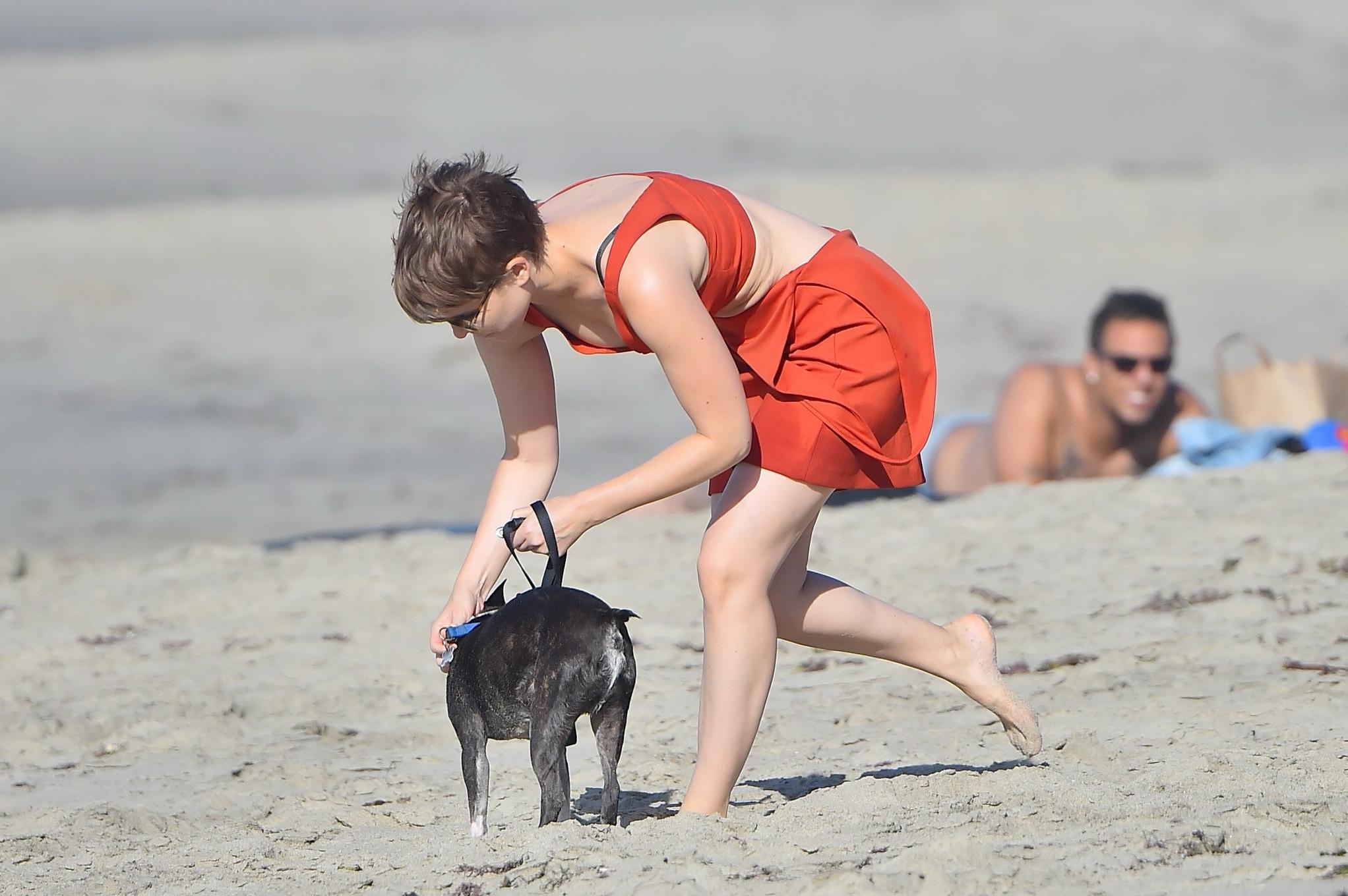16P Kate Mara busty in belly top and mini skirt at the beach