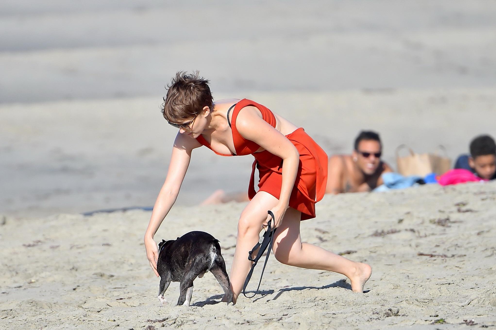 16P Kate Mara busty in belly top and mini skirt at the beach