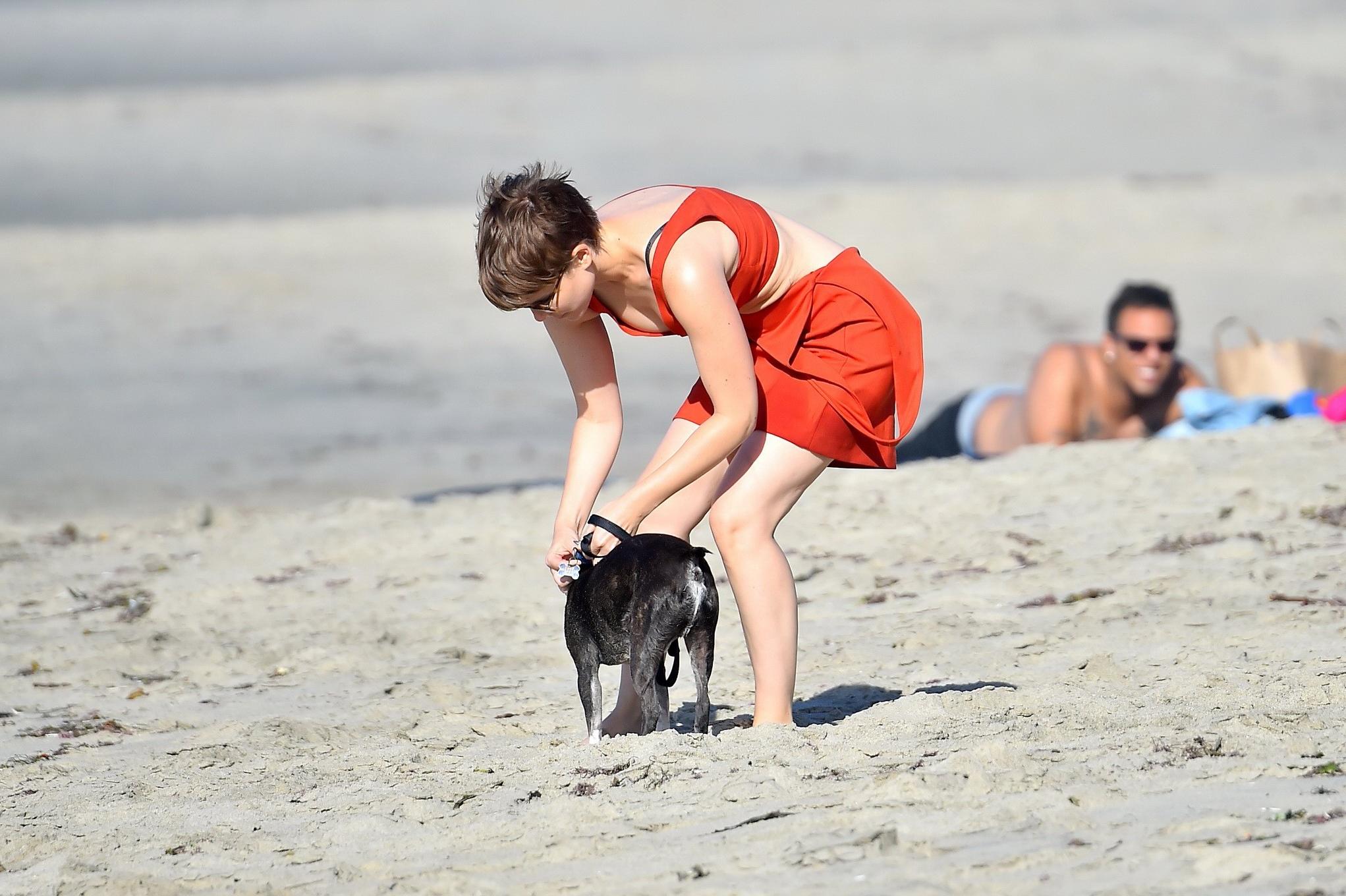 16P Kate Mara busty in belly top and mini skirt at the beach