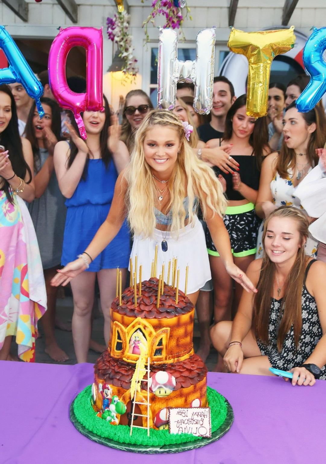 16P Olivia Holt looks hot in belly top and mini skirt for her bday