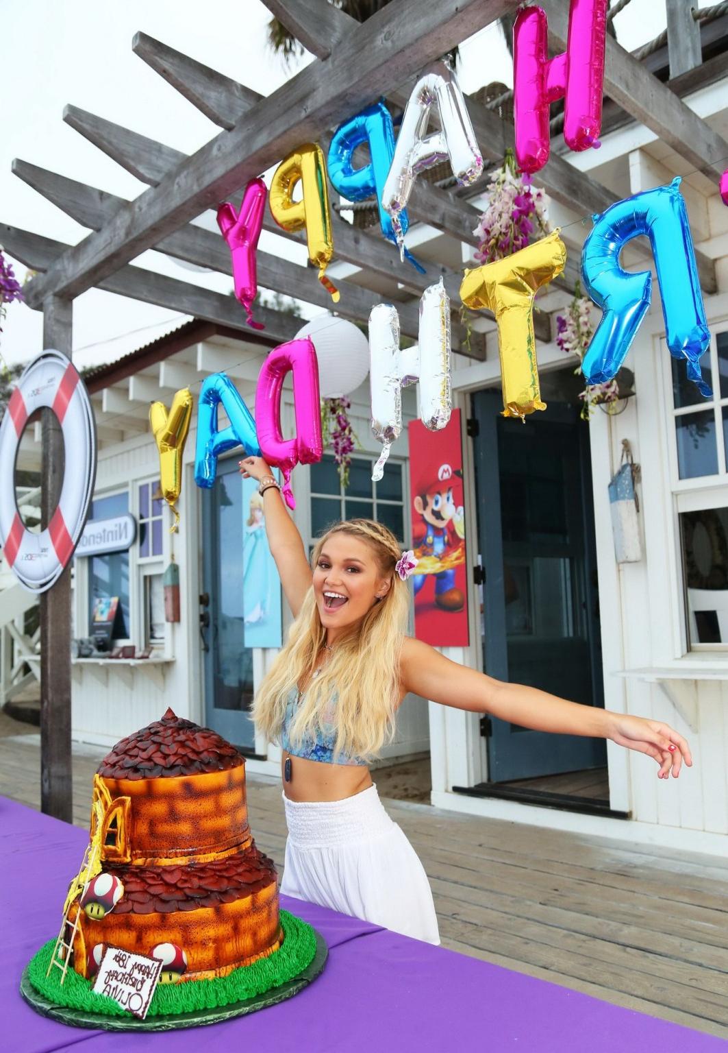 16P Olivia Holt looks hot in belly top and mini skirt for her bday