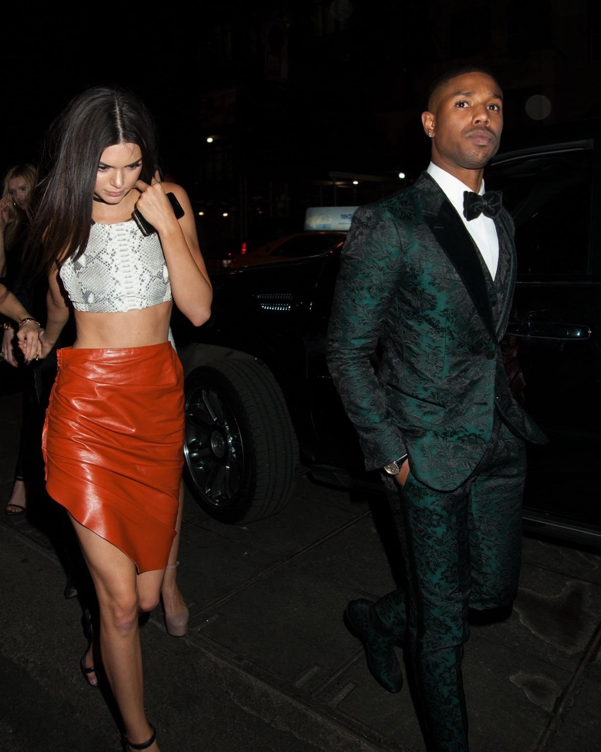 16P Kendall Jenner stunning in snake print belly top and leather mini skirt at YAHOO