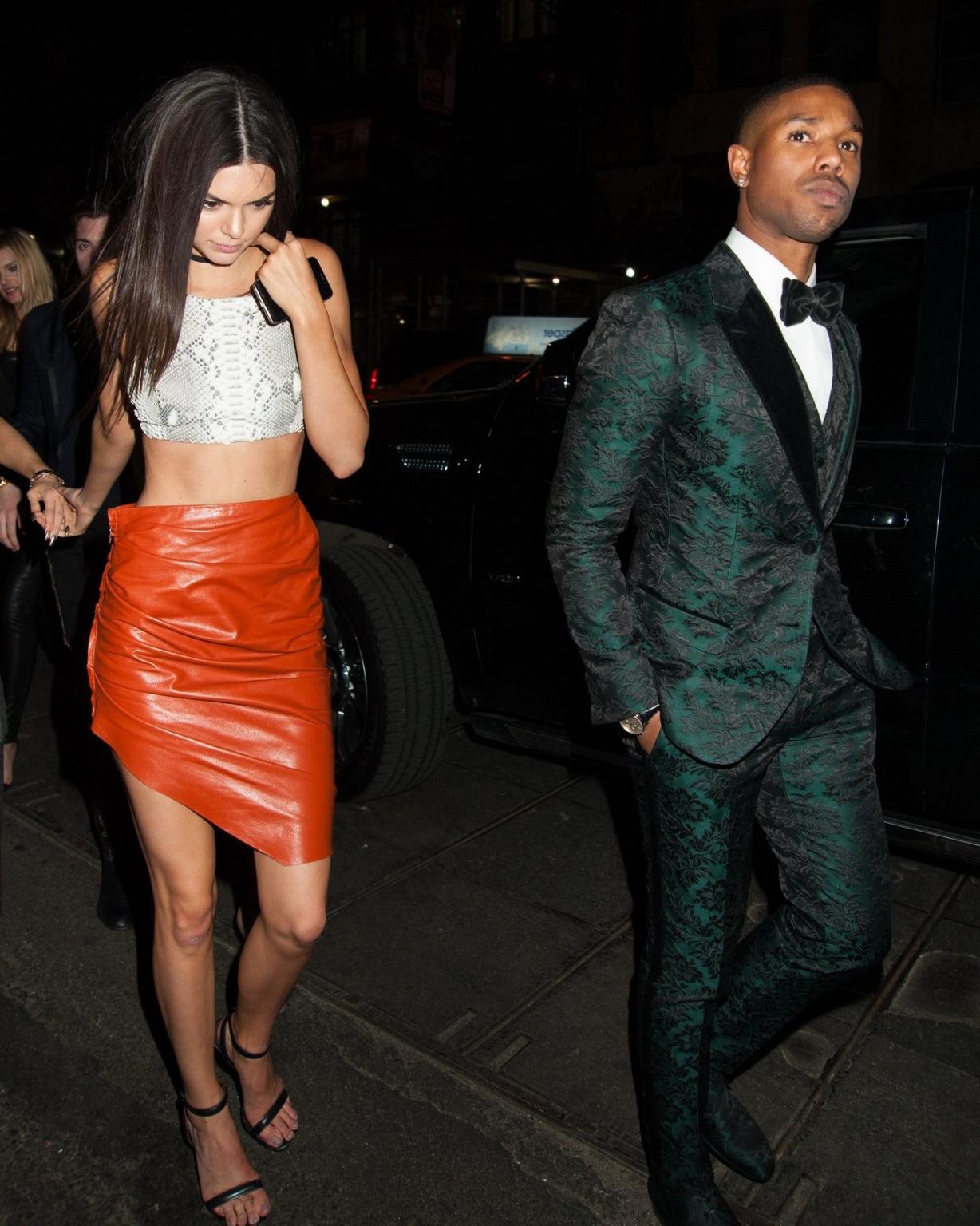 16P Kendall Jenner stunning in snake print belly top and leather mini skirt at YAHOO