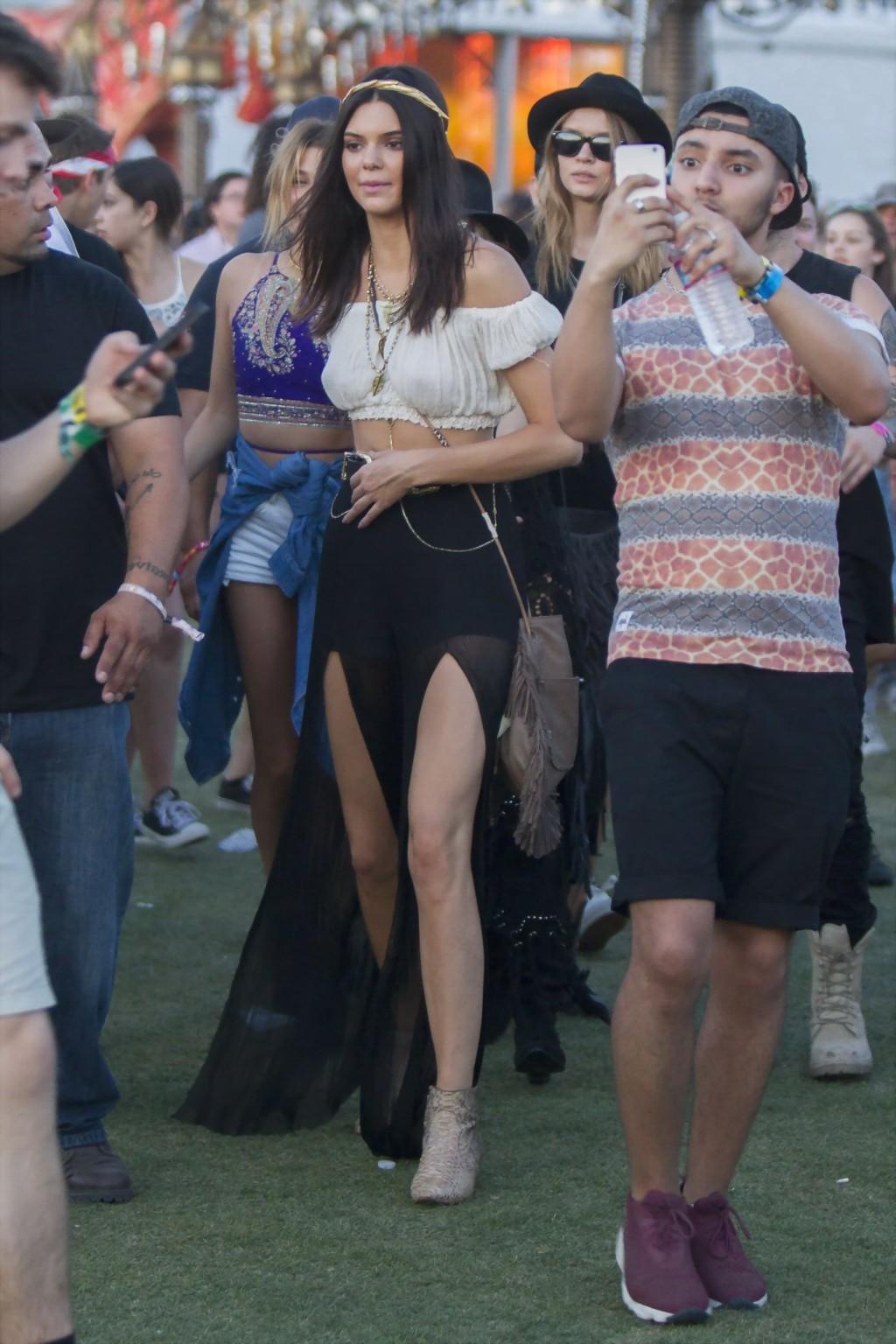 16P Kendall Jenner busty in a seethrough belly top and high slit skirt at Coachella 