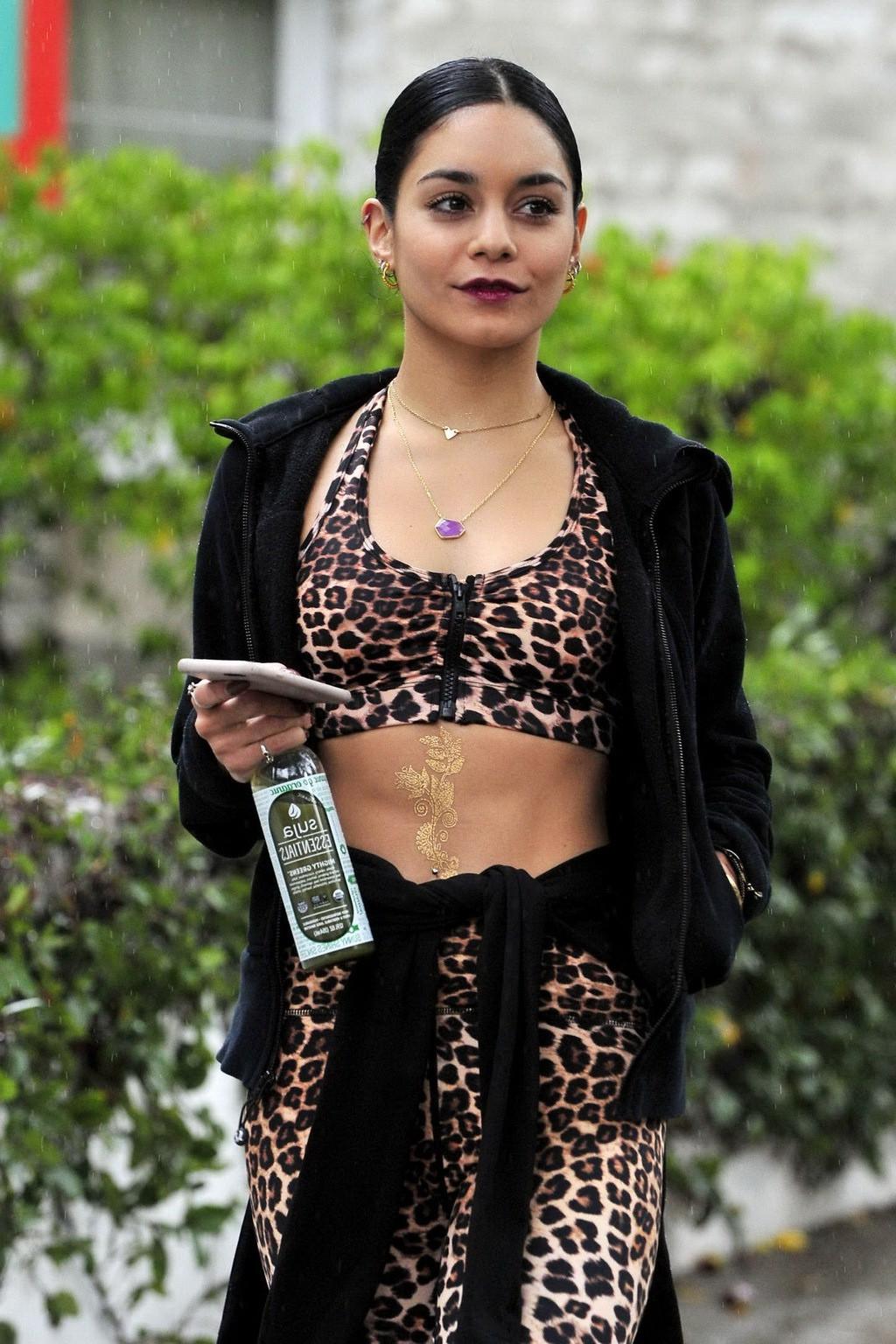 16P Vanessa Hudgens looks hot in leopard print belly top and tights at a rainy day o