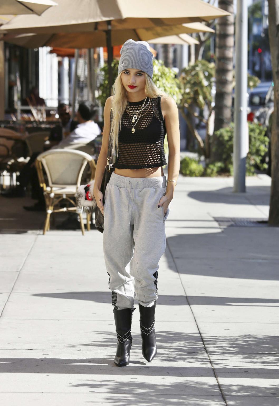 16P Pia Mia Perez wearing black bra under a mesh belly top out in Los Angeles