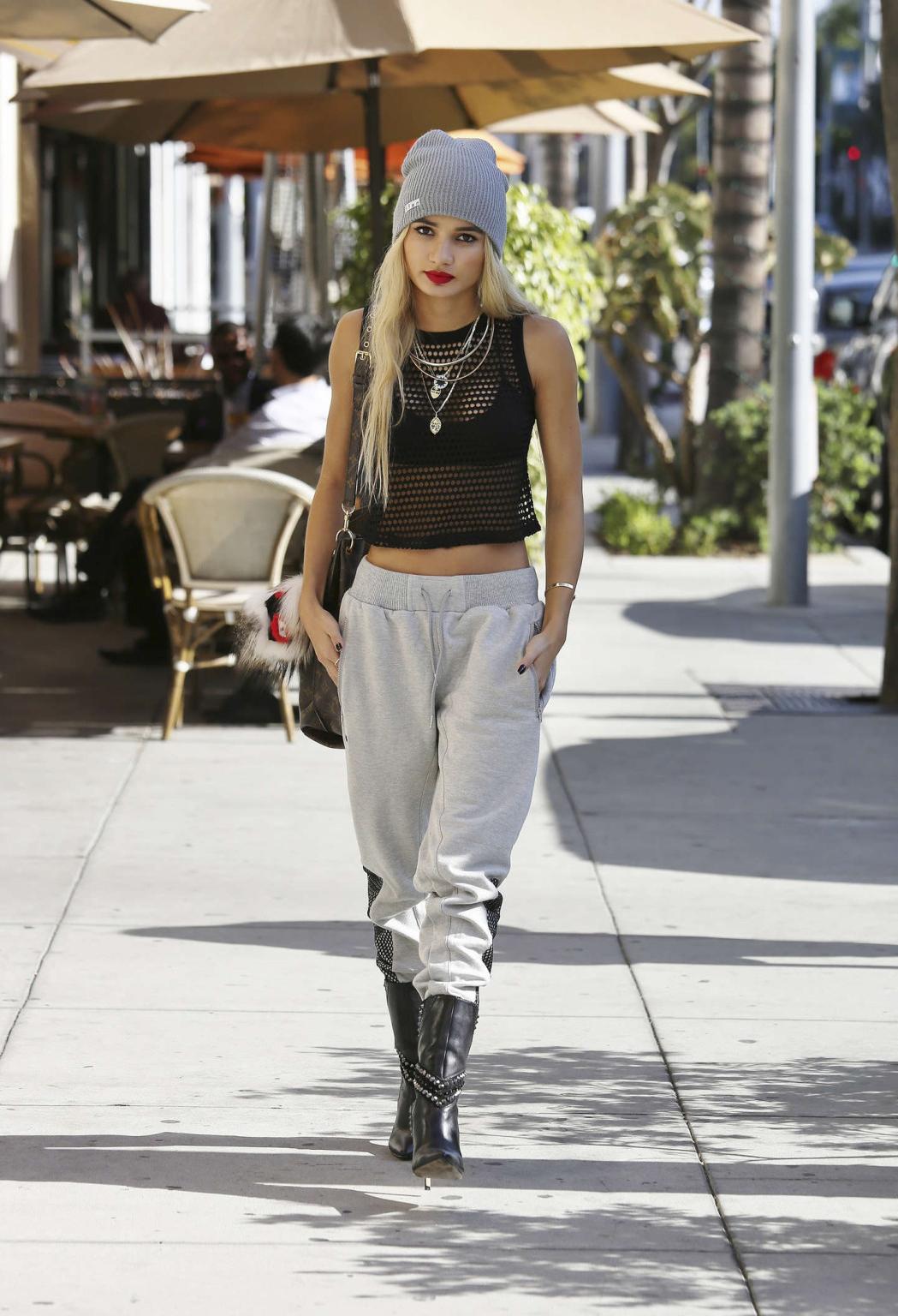 16P Pia Mia Perez wearing black bra under a mesh belly top out in Los Angeles