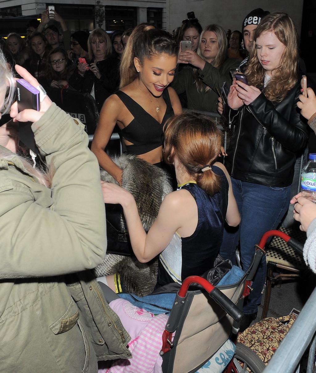 10P Ariana Grande wears skimpy black belly top and short skirt at BBC Radio 1 In Lon