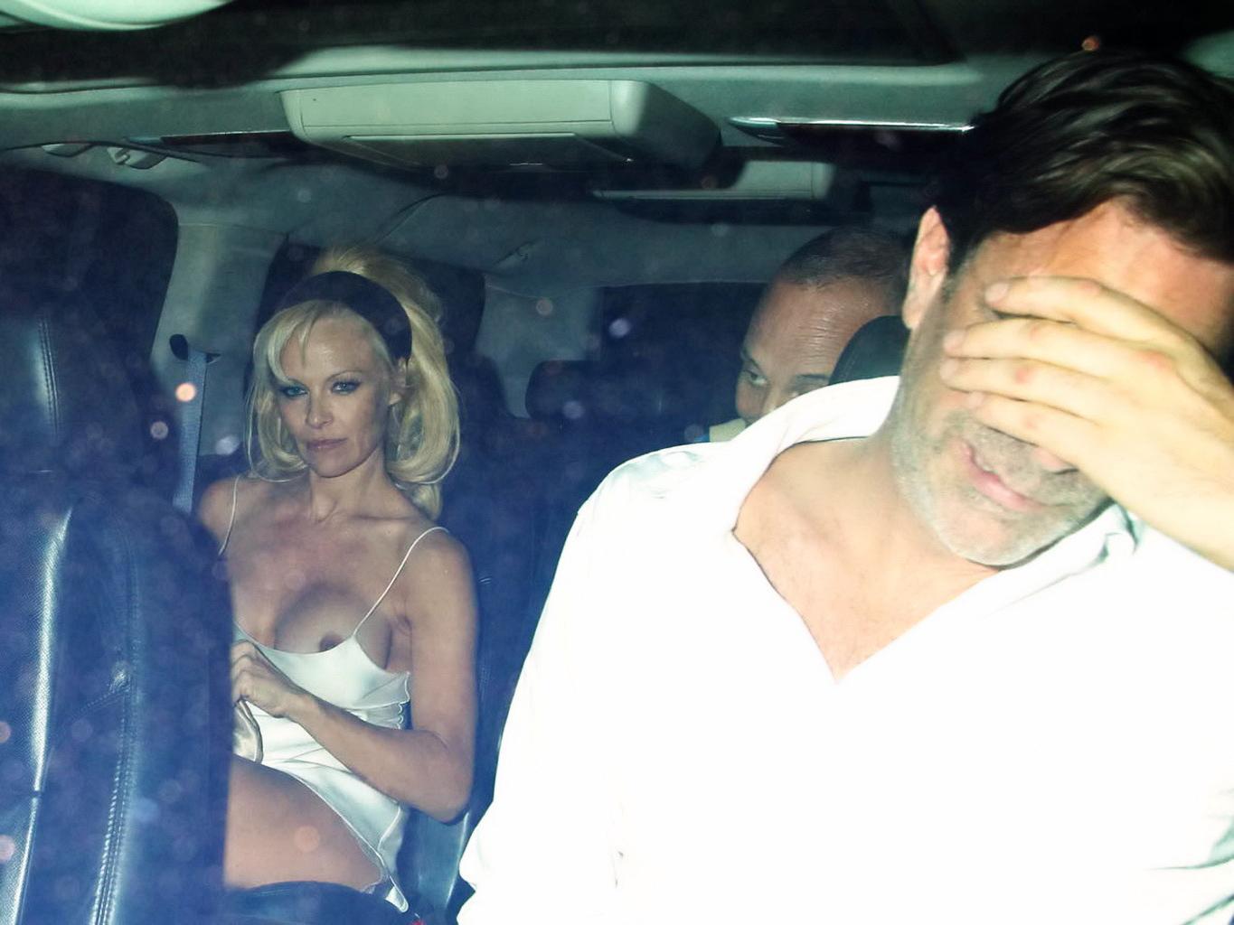10P Pamela Anderson boob slip in the car while leaving Chateau Marmont in West Holly