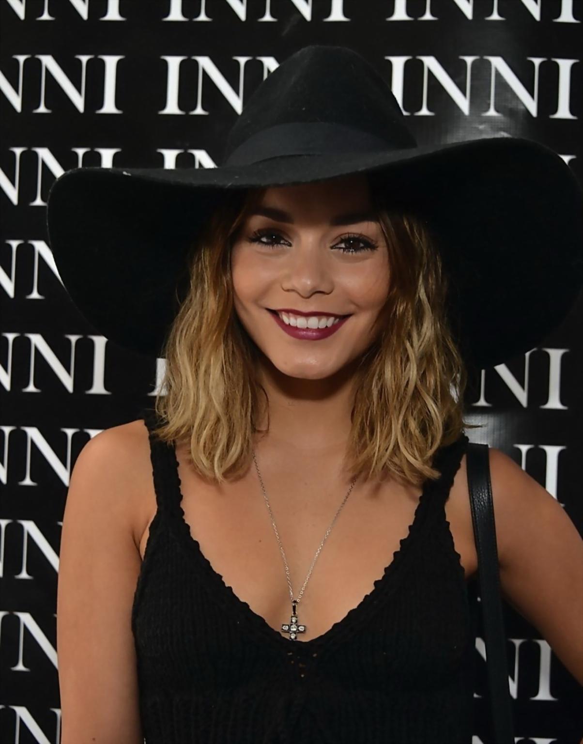 16P Vanessa Hudgens showing big cleavage in black belly top at Kari Feinsteins Style