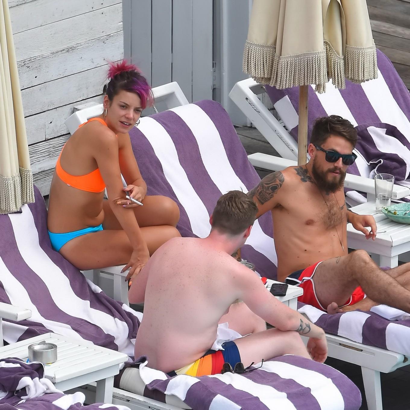 15P Lily Allen in a bikini showing pokies and pussy at the hotel pool in New York