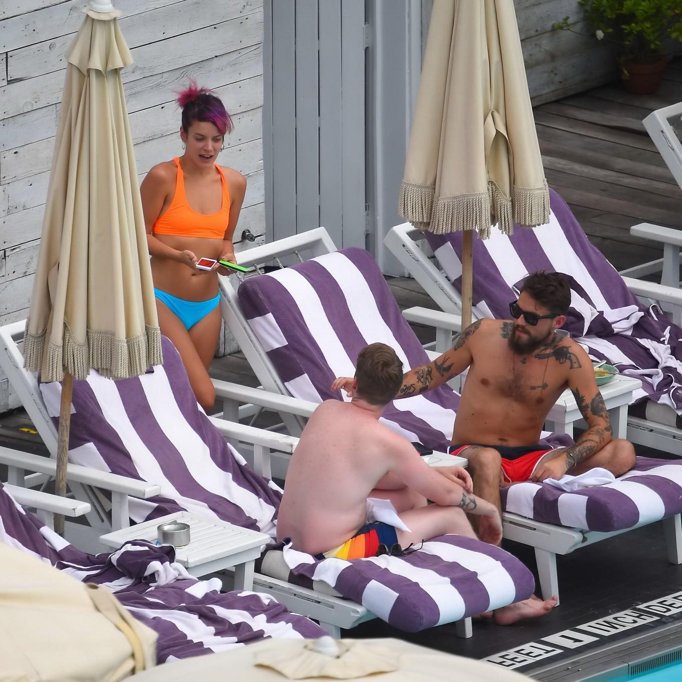 15P Lily Allen in a bikini showing pokies and pussy at the hotel pool in New York