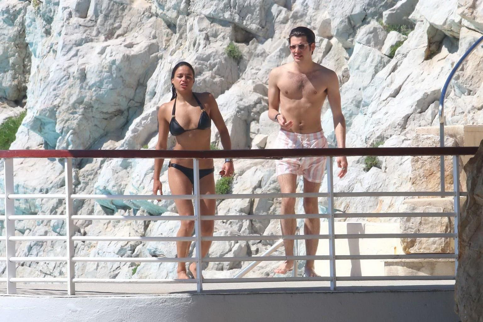 16P Michelle Rodriguez wearing skimpy black bikini poolside at Cap Eden Roc Hotel in