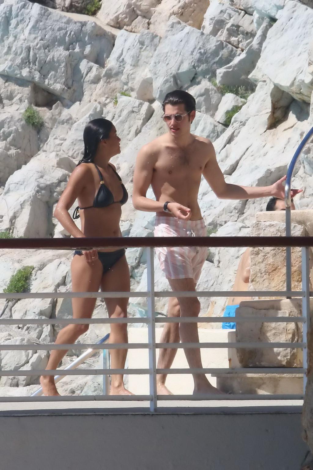 16P Michelle Rodriguez wearing skimpy black bikini poolside at Cap Eden Roc Hotel in