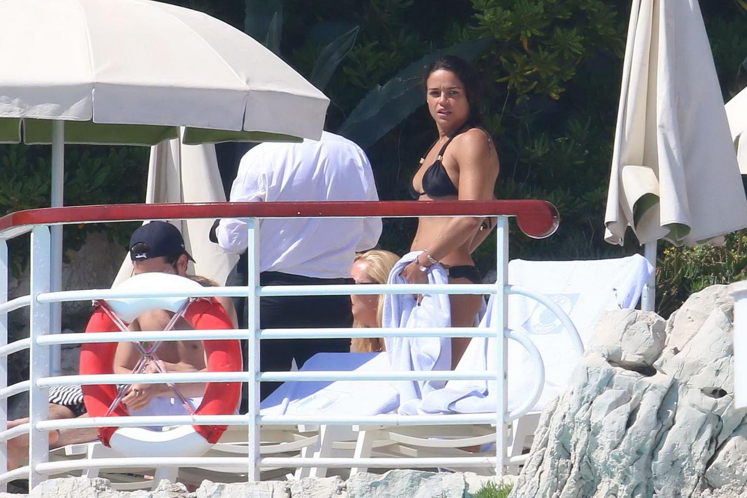 16P Michelle Rodriguez wearing skimpy black bikini poolside at Cap Eden Roc Hotel in
