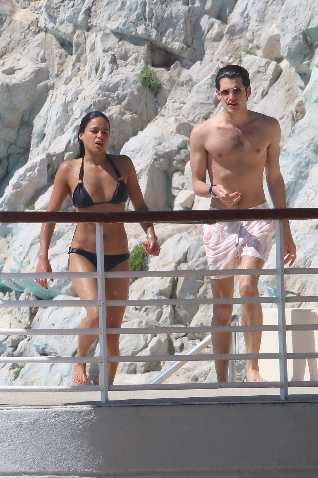 16P Michelle Rodriguez wearing skimpy black bikini poolside at Cap Eden Roc Hotel in