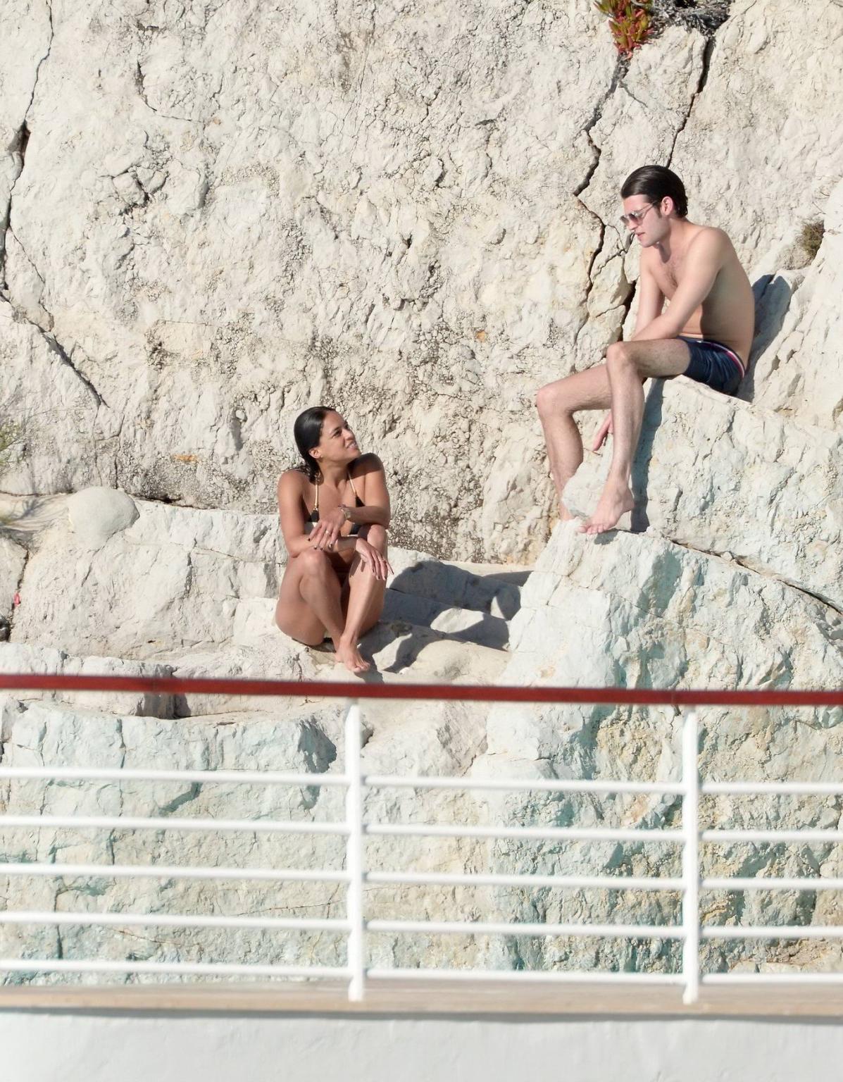 16P Michelle Rodriguez busty in a tiny striped bikini at the Hotel Du CapEdenRoc poo