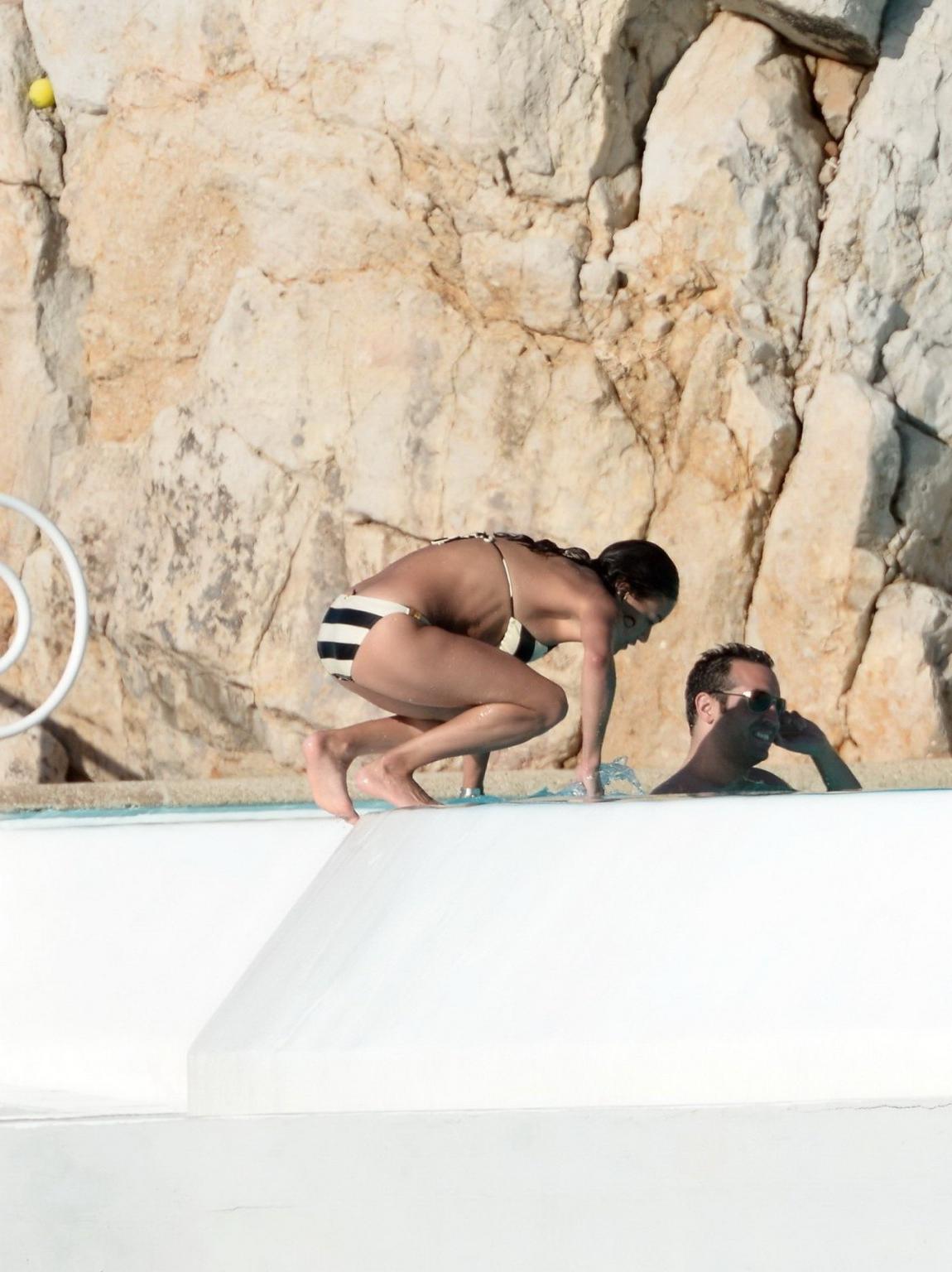 16P Michelle Rodriguez busty in a tiny striped bikini at the Hotel Du CapEdenRoc poo