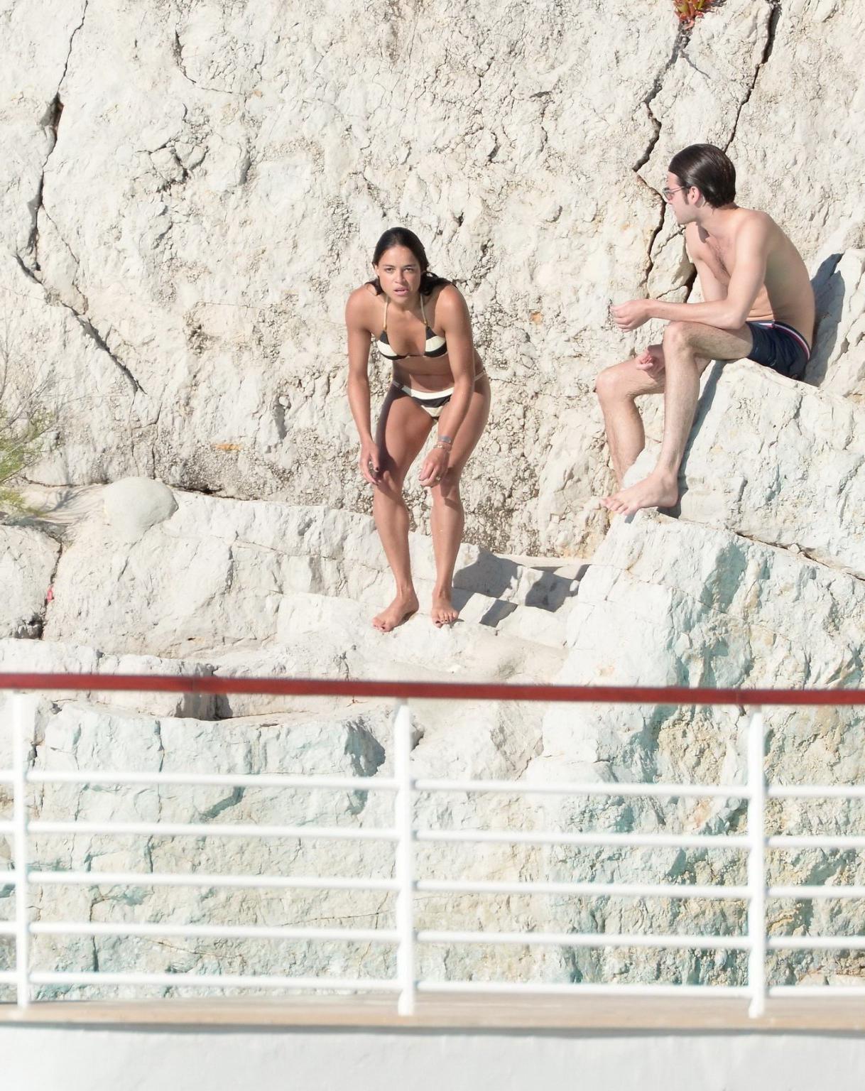16P Michelle Rodriguez busty in a tiny striped bikini at the Hotel Du CapEdenRoc poo