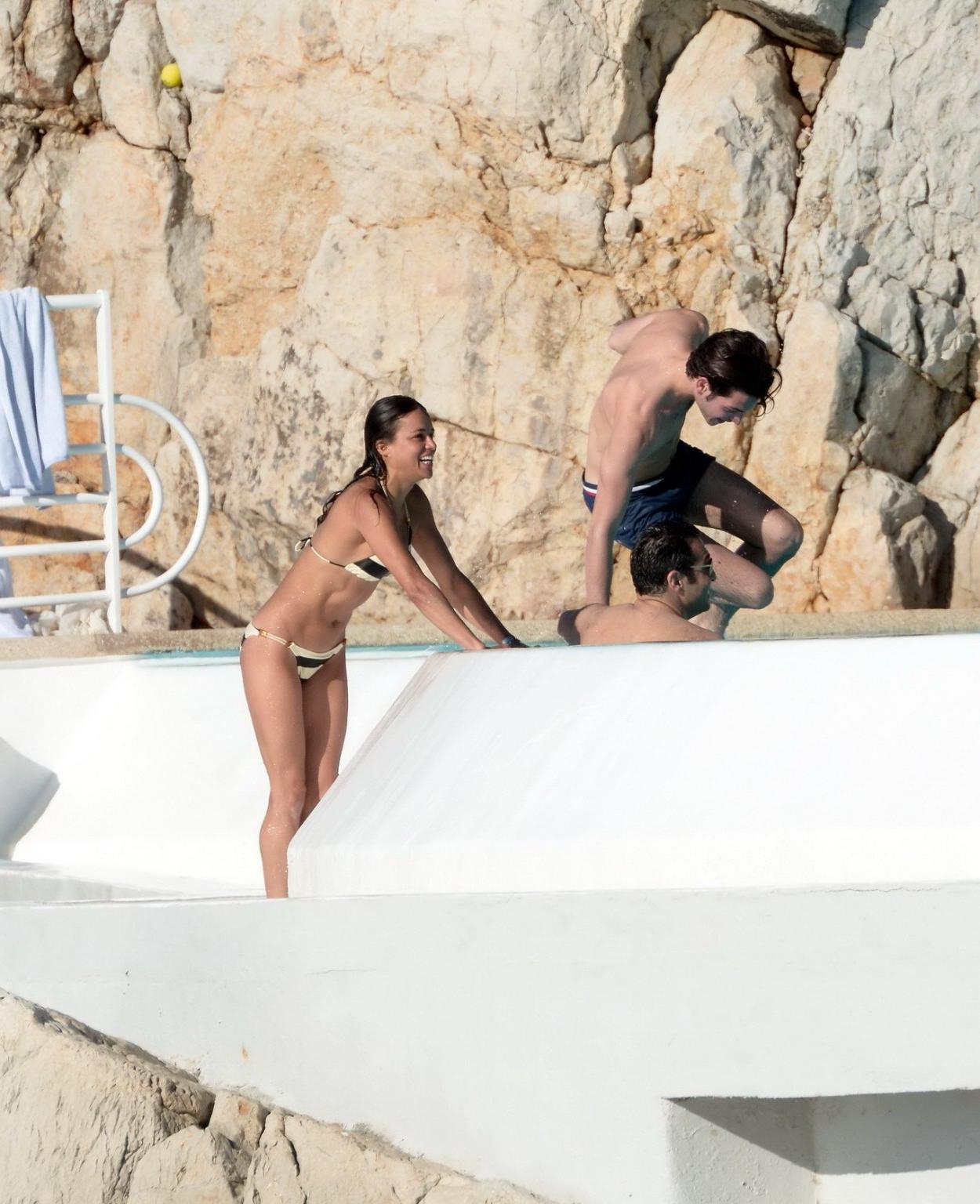16P Michelle Rodriguez busty in a tiny striped bikini at the Hotel Du CapEdenRoc poo