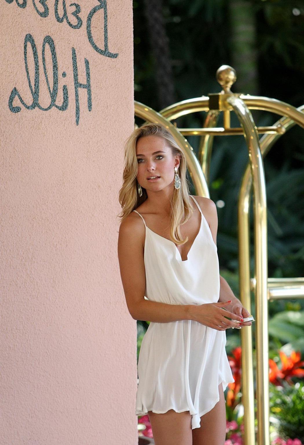 16P Kimberley Garner leggy wearing white mini dress outside the Beverly Hills Hotel