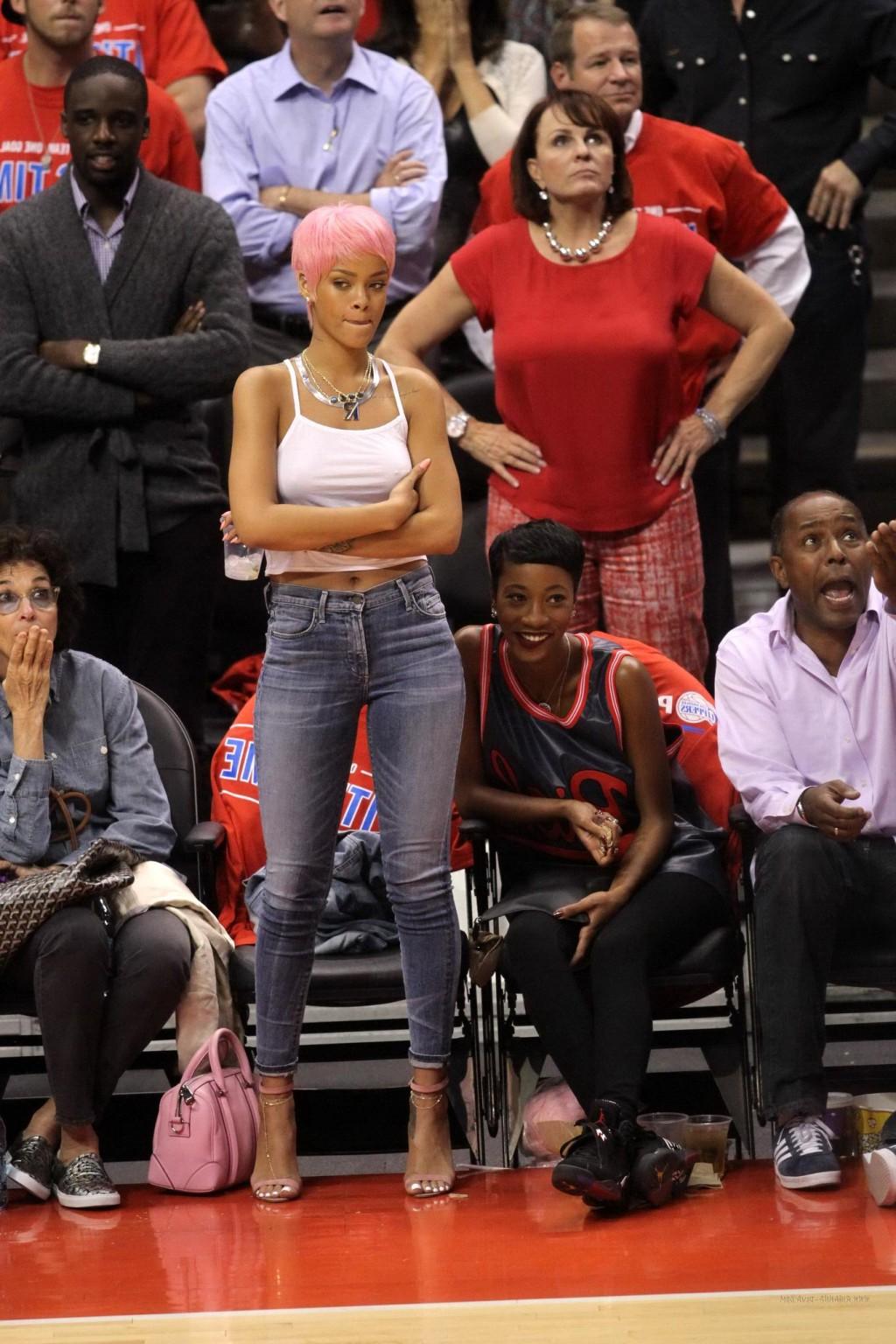 16P Rihanna braless wearing a white top at the Clippers game in LA