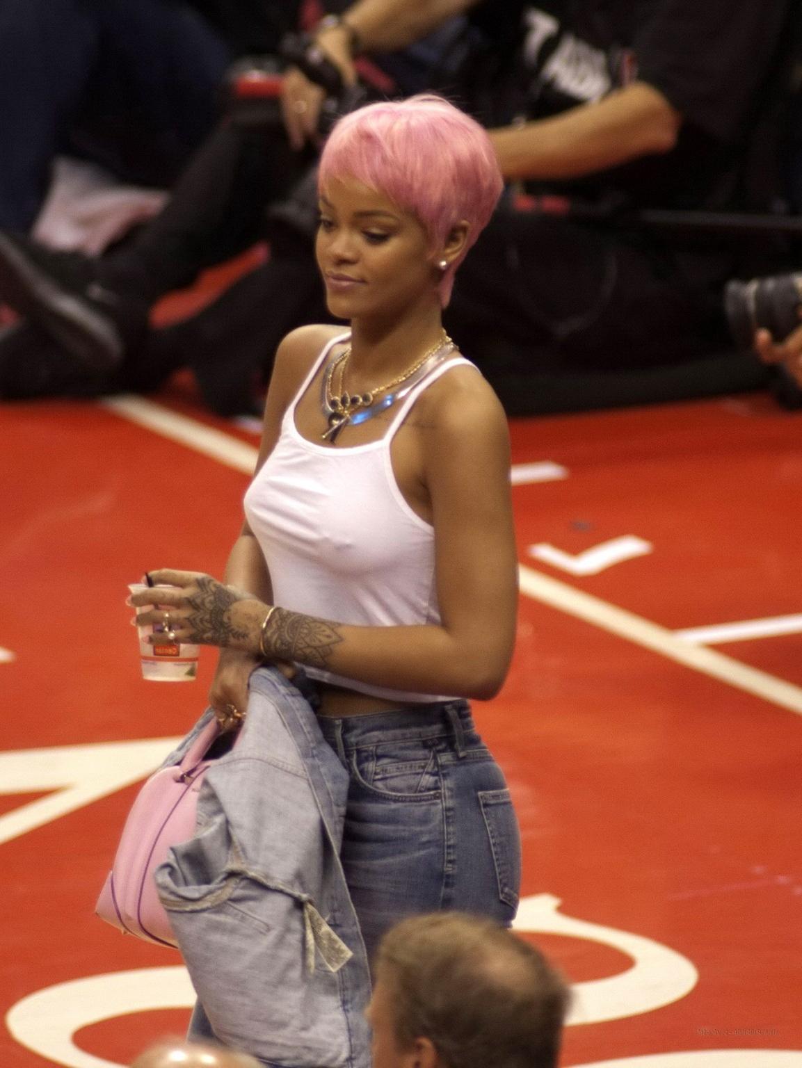 16P Rihanna braless wearing a white top at the Clippers game in LA