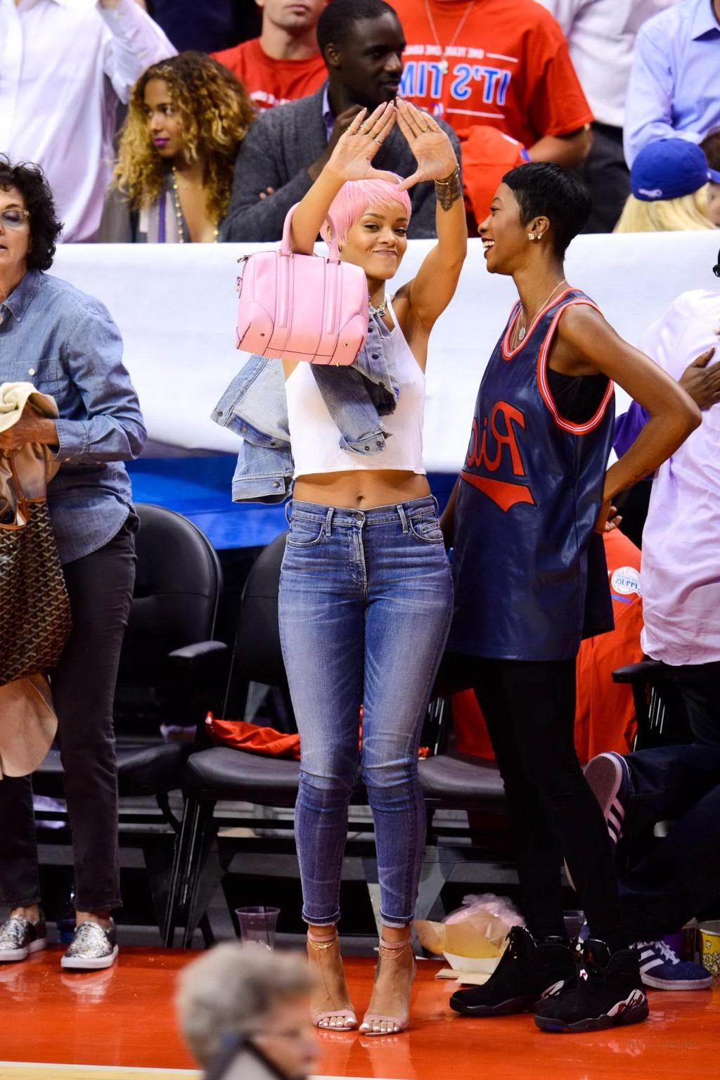 16P Rihanna braless wearing a white top at the Clippers game in LA