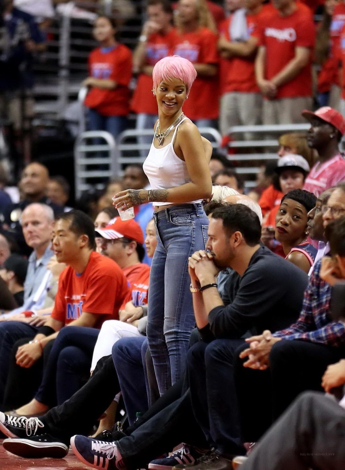 16P Rihanna braless wearing a white top at the Clippers game in LA