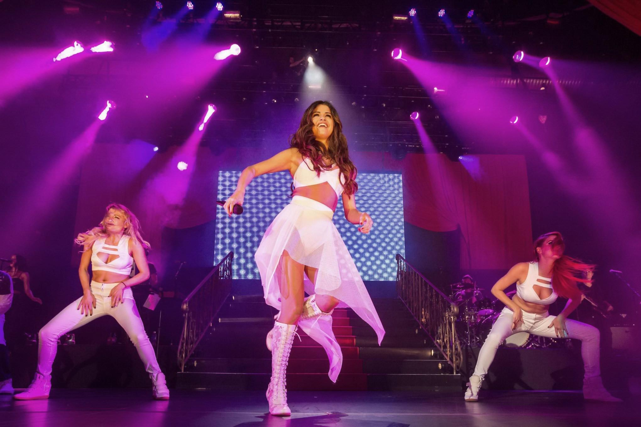16P Selena Gomez wearing tiny white belly top and see-through skirt while performs a