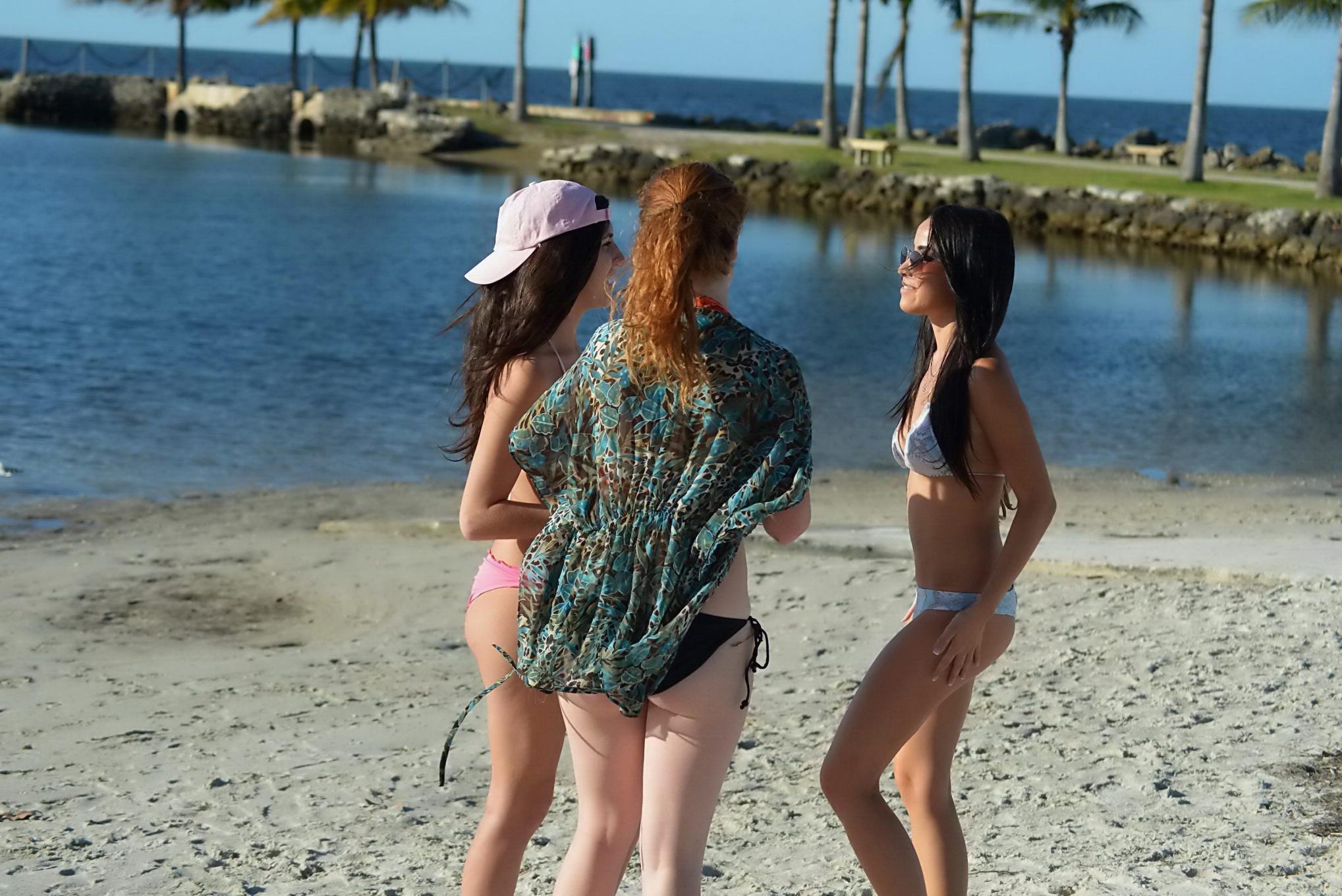 16P Lisa Opie tanning her perfect body in bright colored thong bikini at Miami Beach