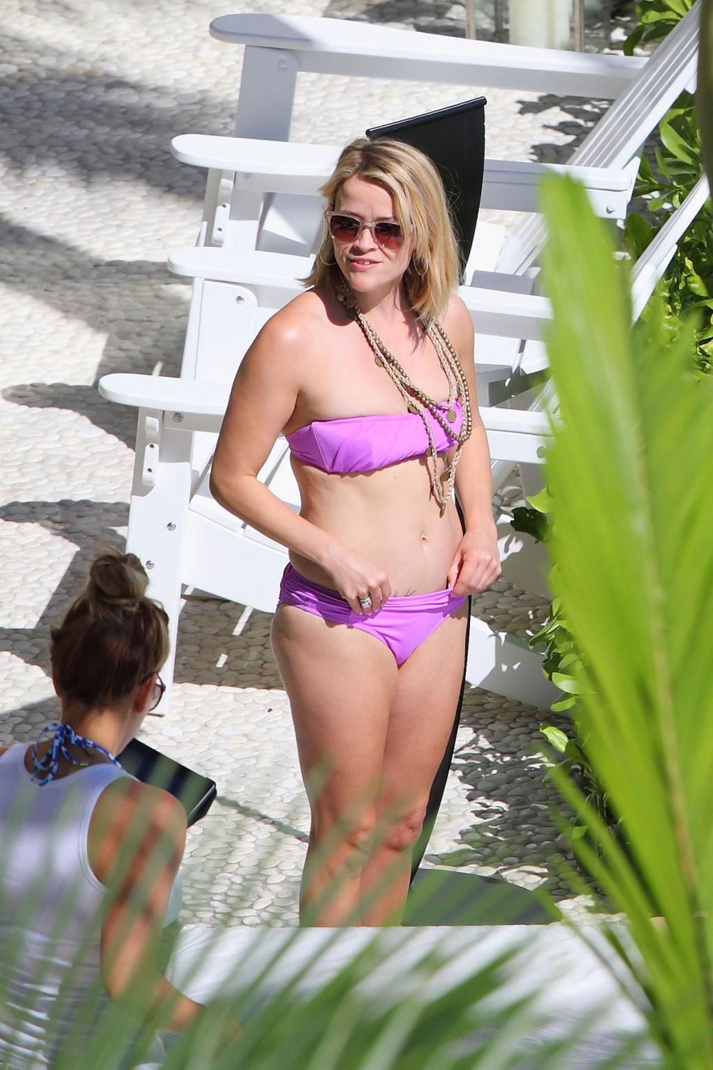 16P Reese Witherspoon tanning in skimpy pink tube bikini at her hotel in Hawaii