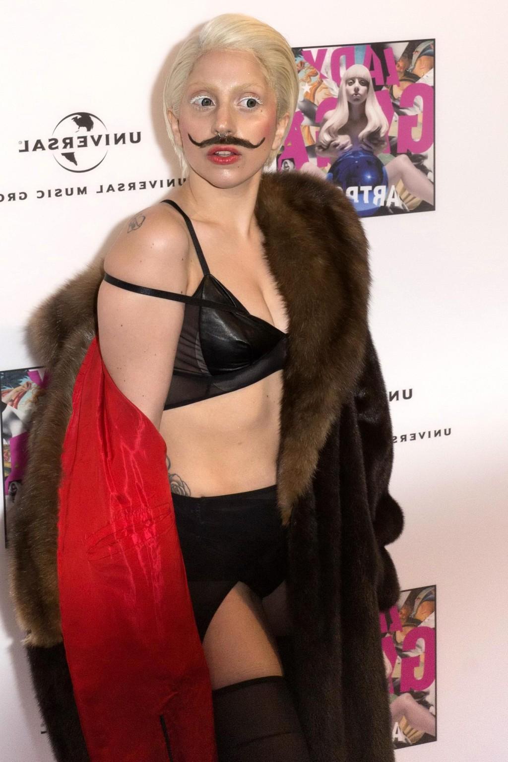 16P Lady Gaga wearing lingerie and fake moustache at her album promotion in Berlin