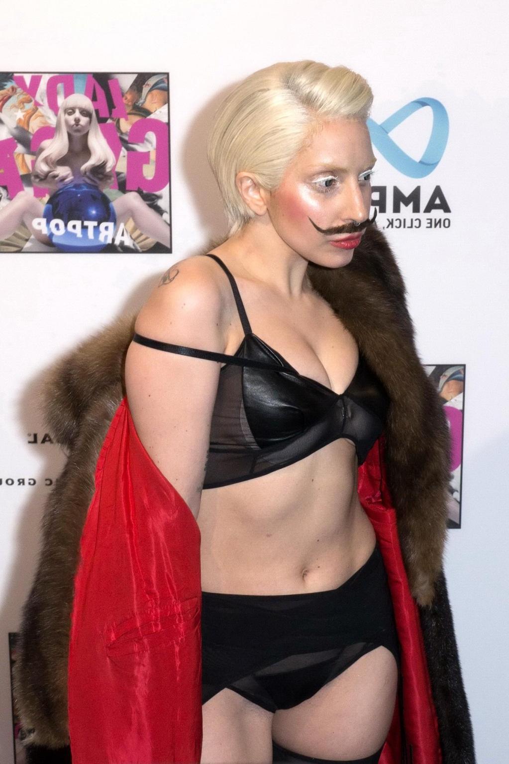 16P Lady Gaga wearing lingerie and fake moustache at her album promotion in Berlin