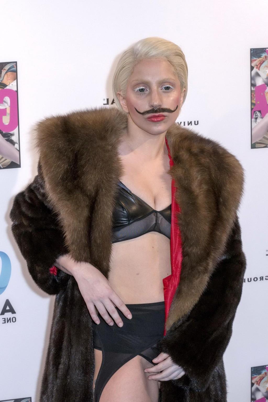 16P Lady Gaga wearing lingerie and fake moustache at her album promotion in Berlin